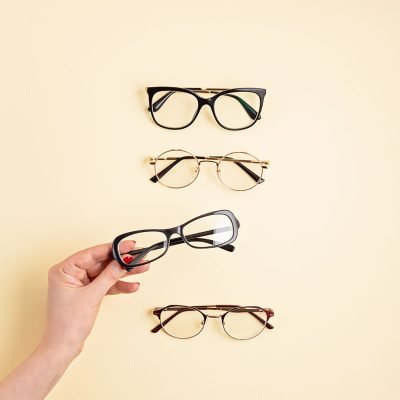 woman-hand-holding-eyeglasses-optical-store-glas-2021-08-30-12-08-32-utc-copy.jpg
